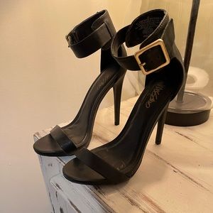 Black leather, large buckle , thick strappy pumps. Worn twice. Women’s size 6.